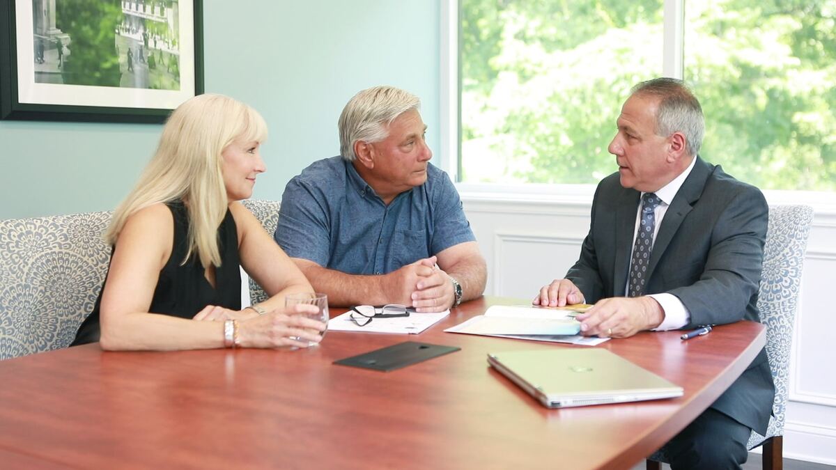 Millstone Financial Group advisor meeting with clients
